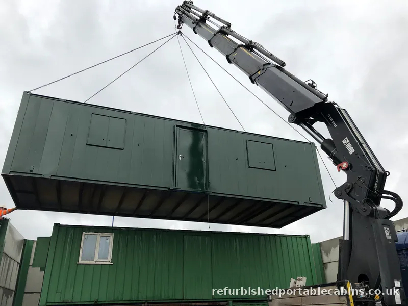 Portable cabin lifted by our HIAB onto a stacked cabin set-up