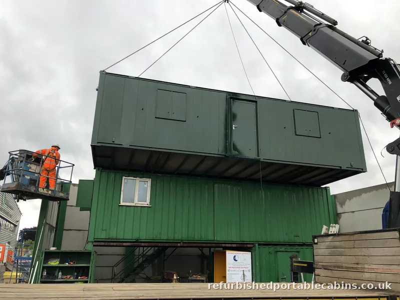 Cabin lifted back into a stacked set-up at its new site