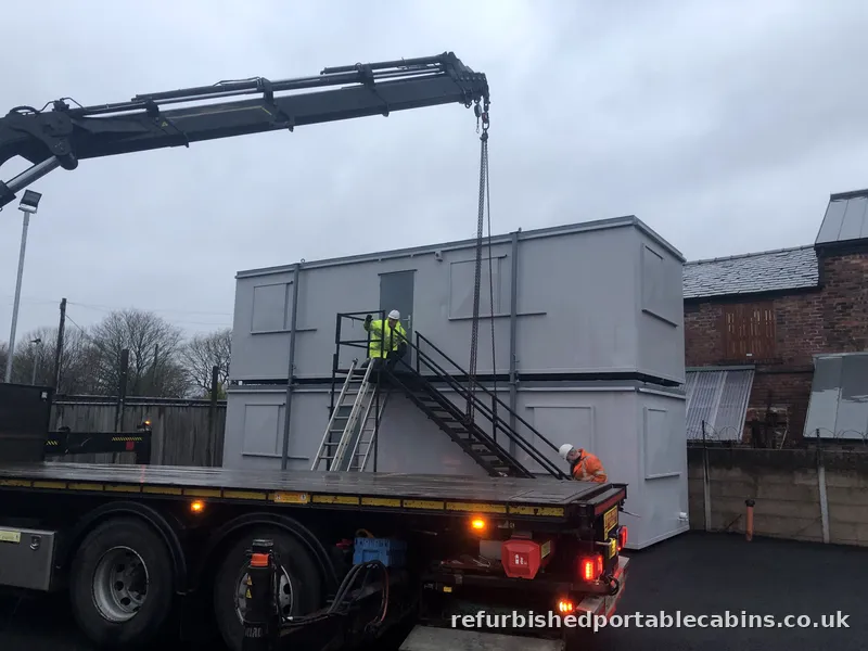 Double portable cabin set-up being lifted into place in Manchester