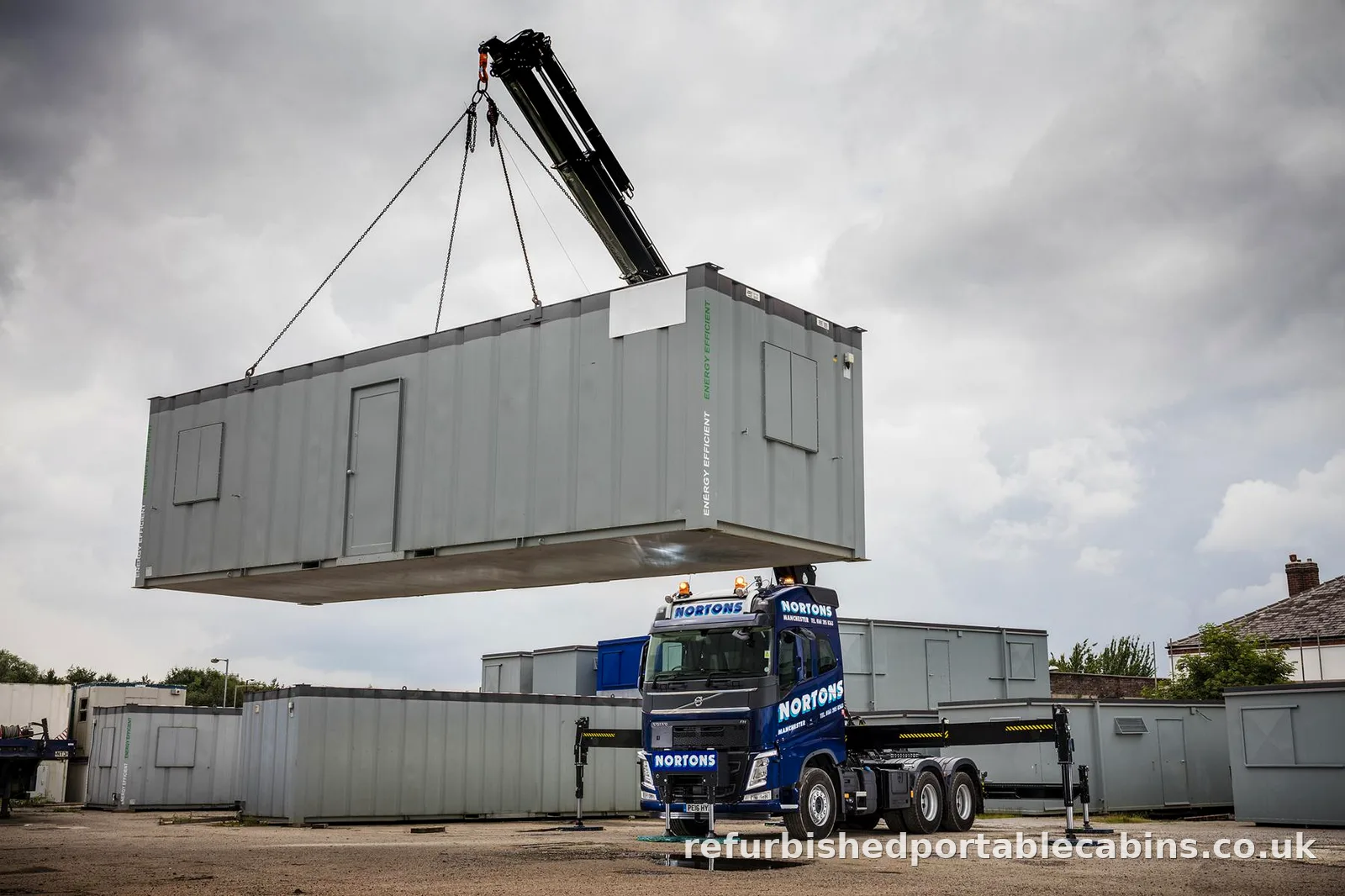 Refurbished portable cabin lifted by our HIAB lorry for UK-wide delivery