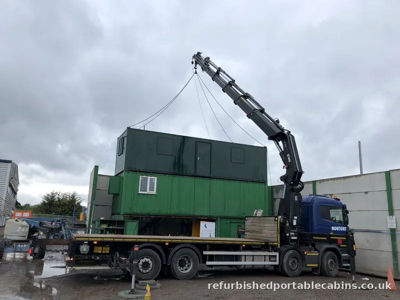 HIAB lifting a portable cabin off site for relocation