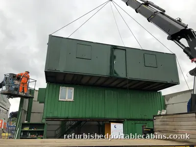Refurbished portable cabins set up three high by our HIAB