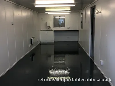 Refurbished cabin interior with fitted kitchen area