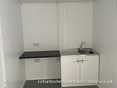 Kitchen area combined with office space in one cabin