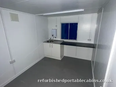 Fitted kitchen run in a refurbished cabin