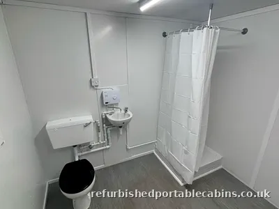 Shower, toilet and basin in one refurbished cabin washroom