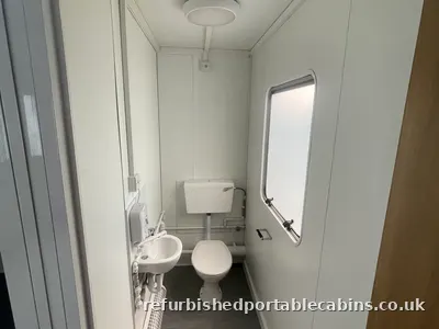 WC, basin and window in a refurbished cabin toilet