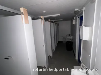 Washroom area of a refurbished portable toilet block