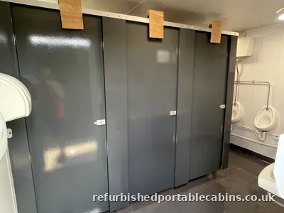 Toilet cubicles and urinals in a refurbished toilet block