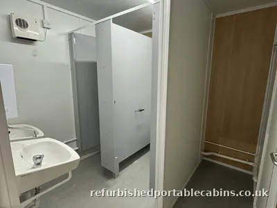 Wash basin and cubicle in a refurbished cabin washroom