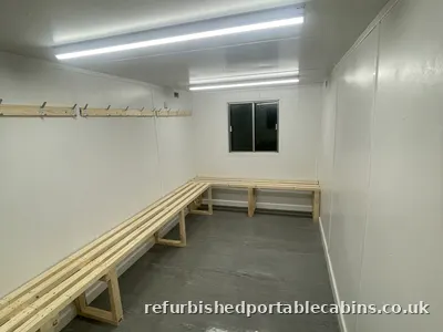 Long bench and hanging space in a refurbished changing room