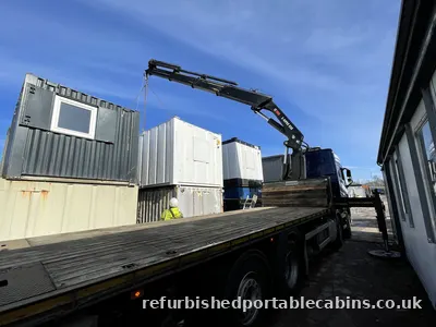 Wagon and drag loaded with refurbished portable cabins
